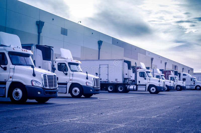 transport-shipping-logistics-concept-image-trucks-loading-unloading-factory-warehouse-46109326